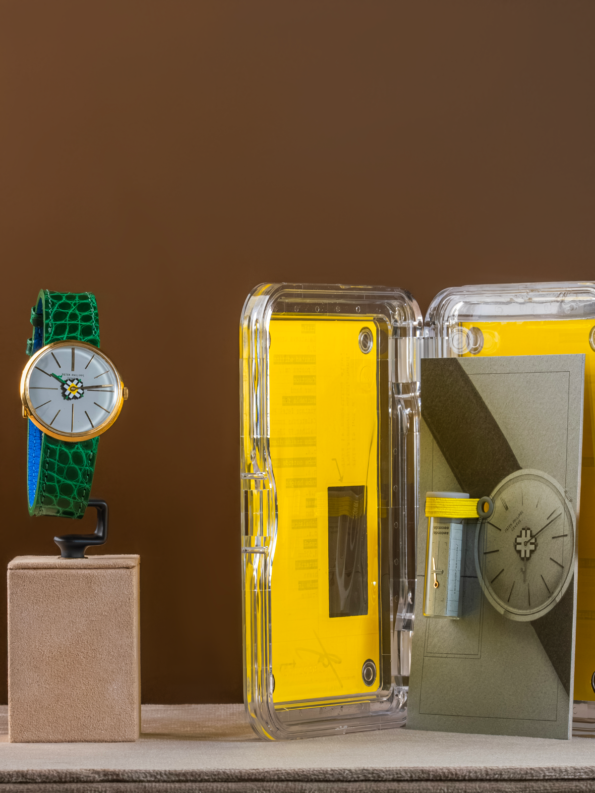 Watch with green strap and yellow case on a brown background