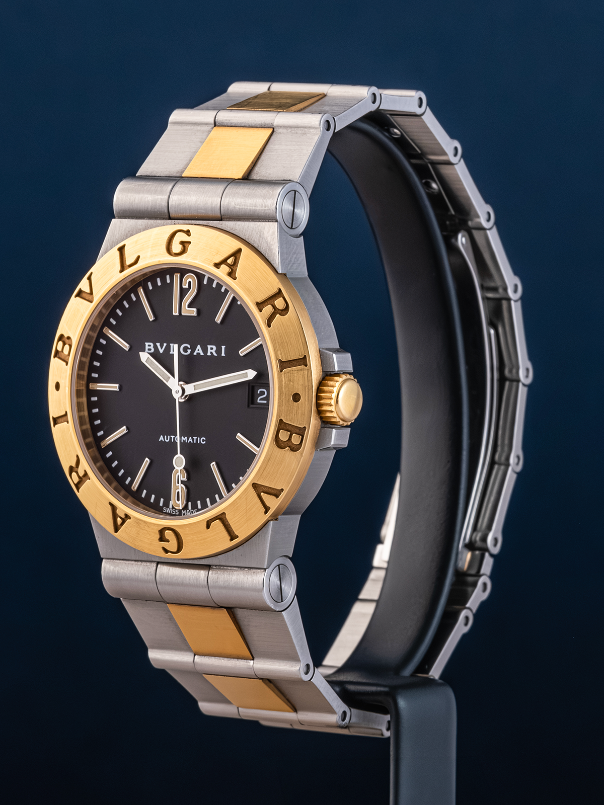 Bulgari watch with gold and silver band on a dark background