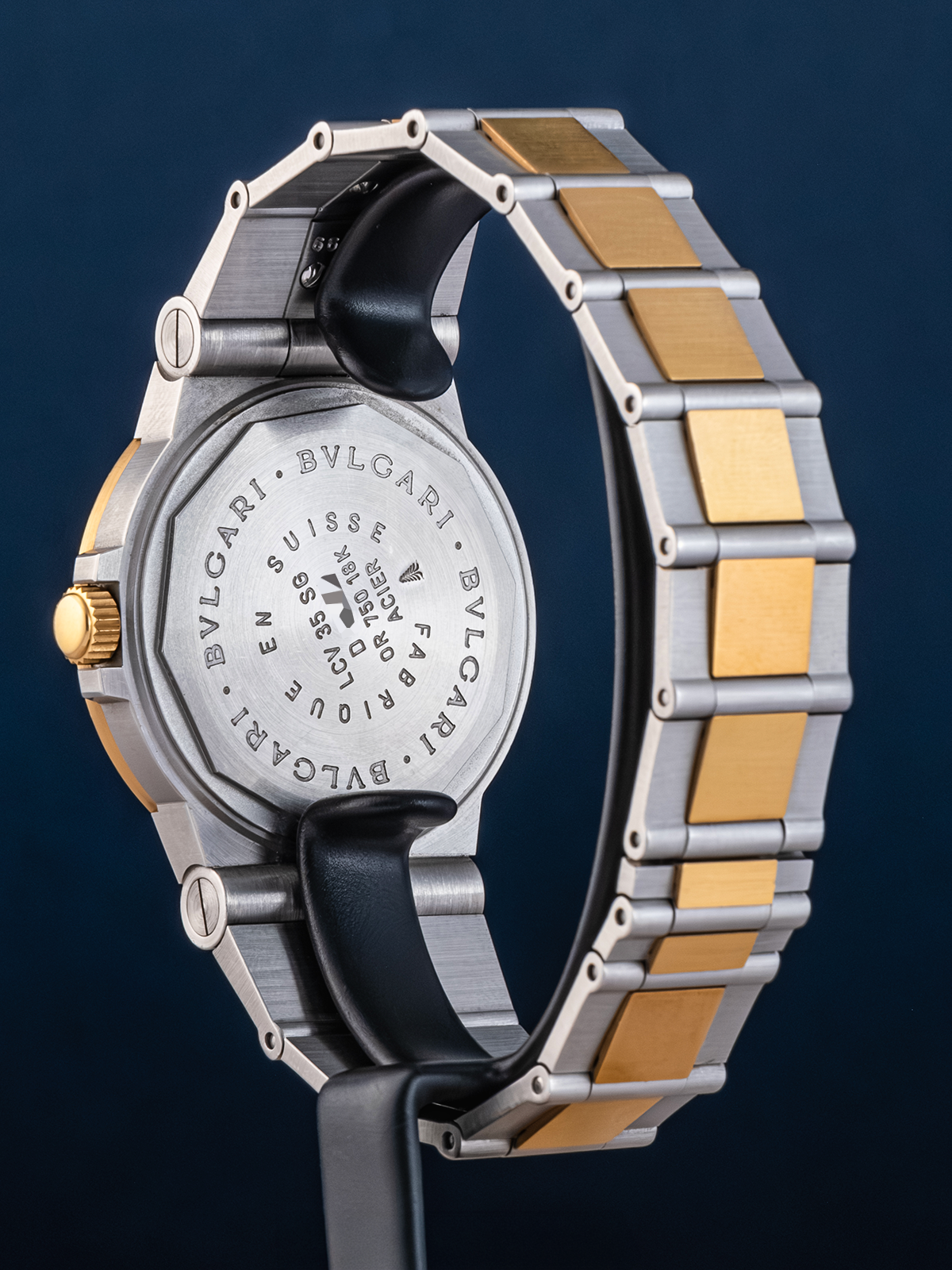 Bulgari watch with silver and gold band on a dark background