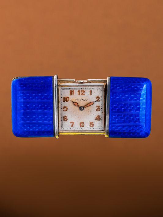 Vintage Cartier watch with blue accents on a brown background