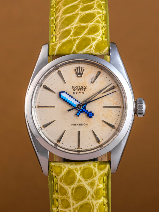 Watch with a green lizard-textured strap on a brown background