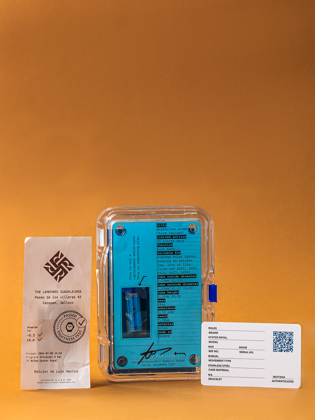 Clear plastic packaging with blue label and white card on orange background