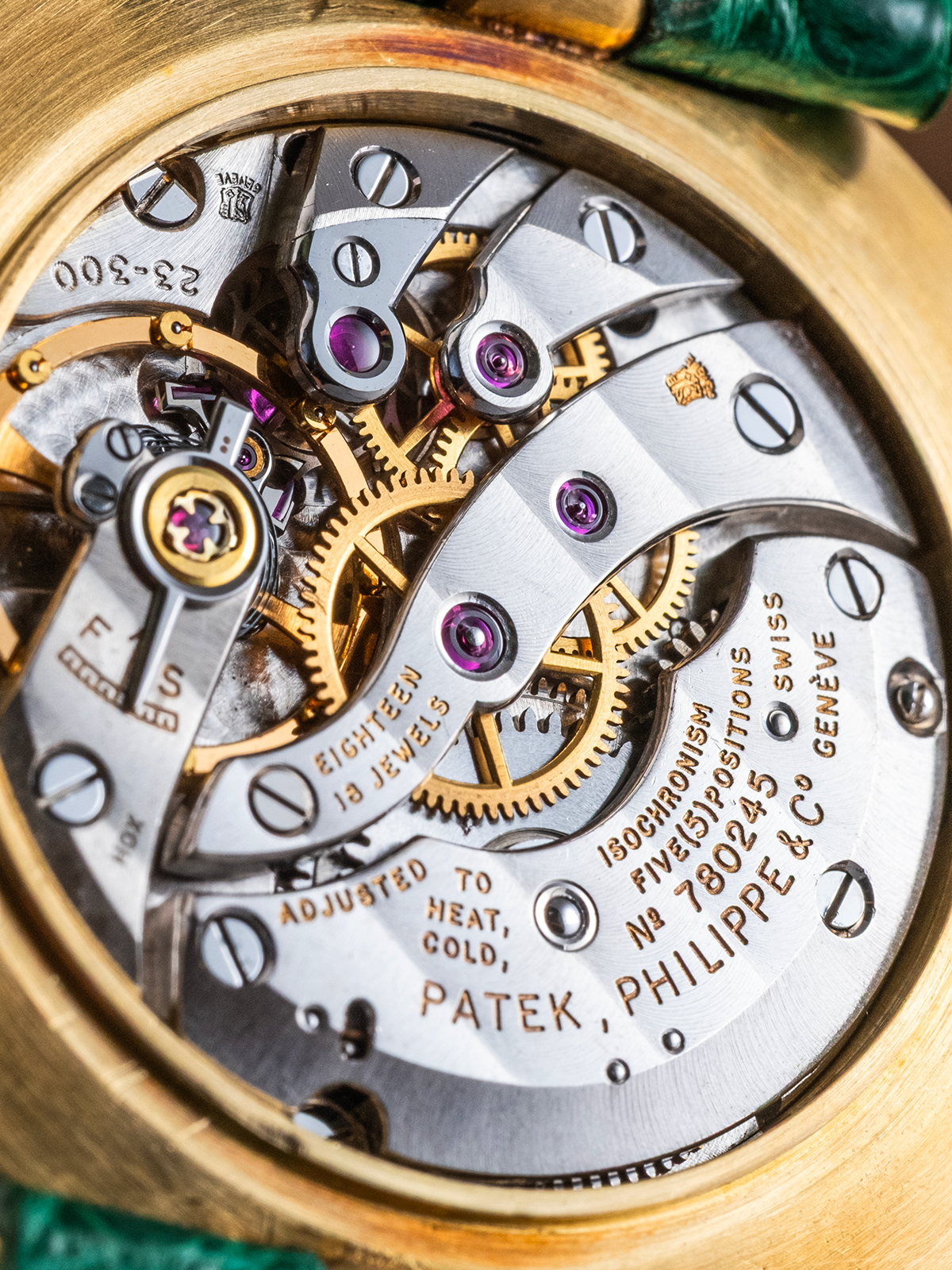 Close-up of a Patek Philippe watch mechanism with visible branding.