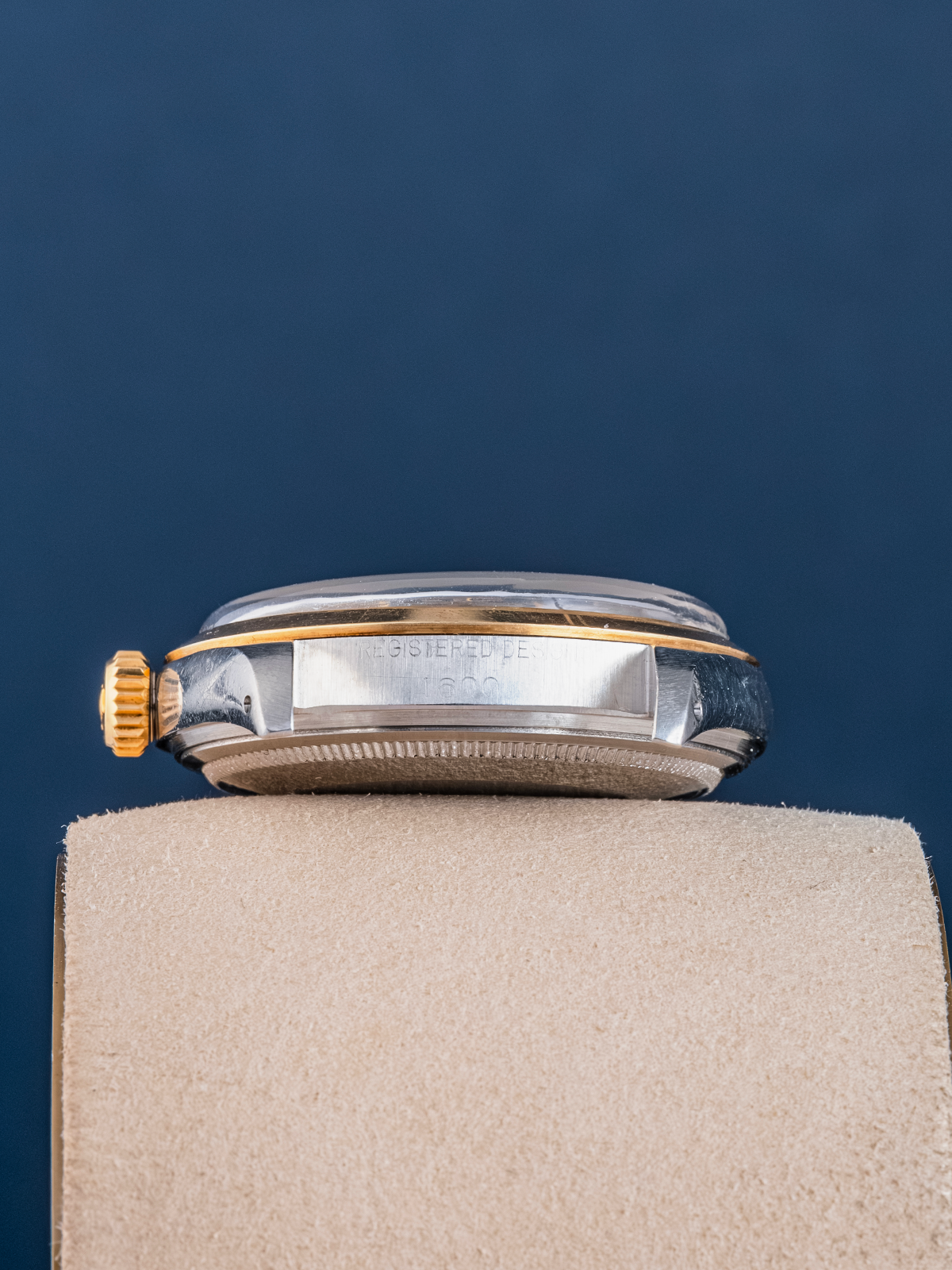 Watch on a stand with a dark blue background