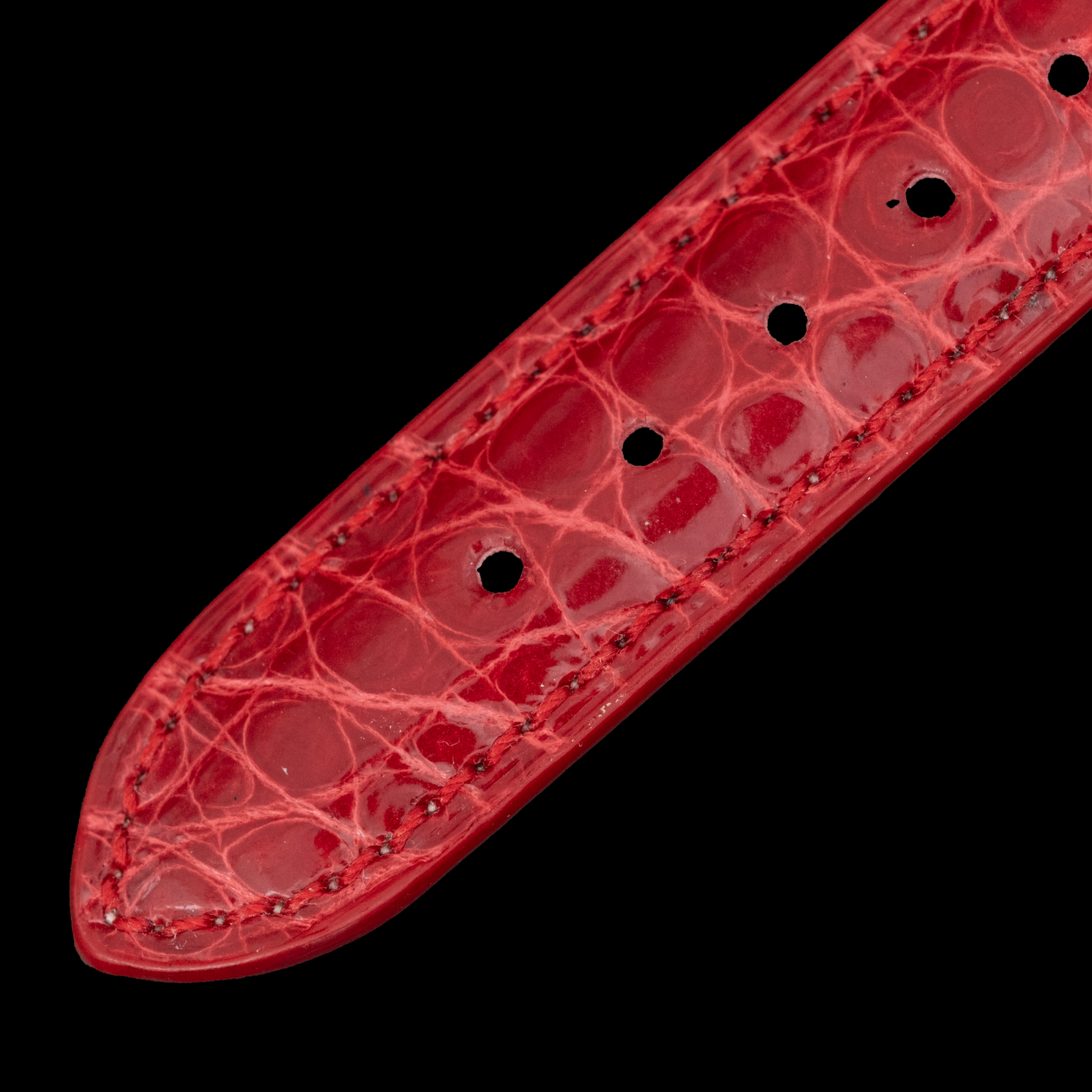 Close-up of a red textured object with a black background